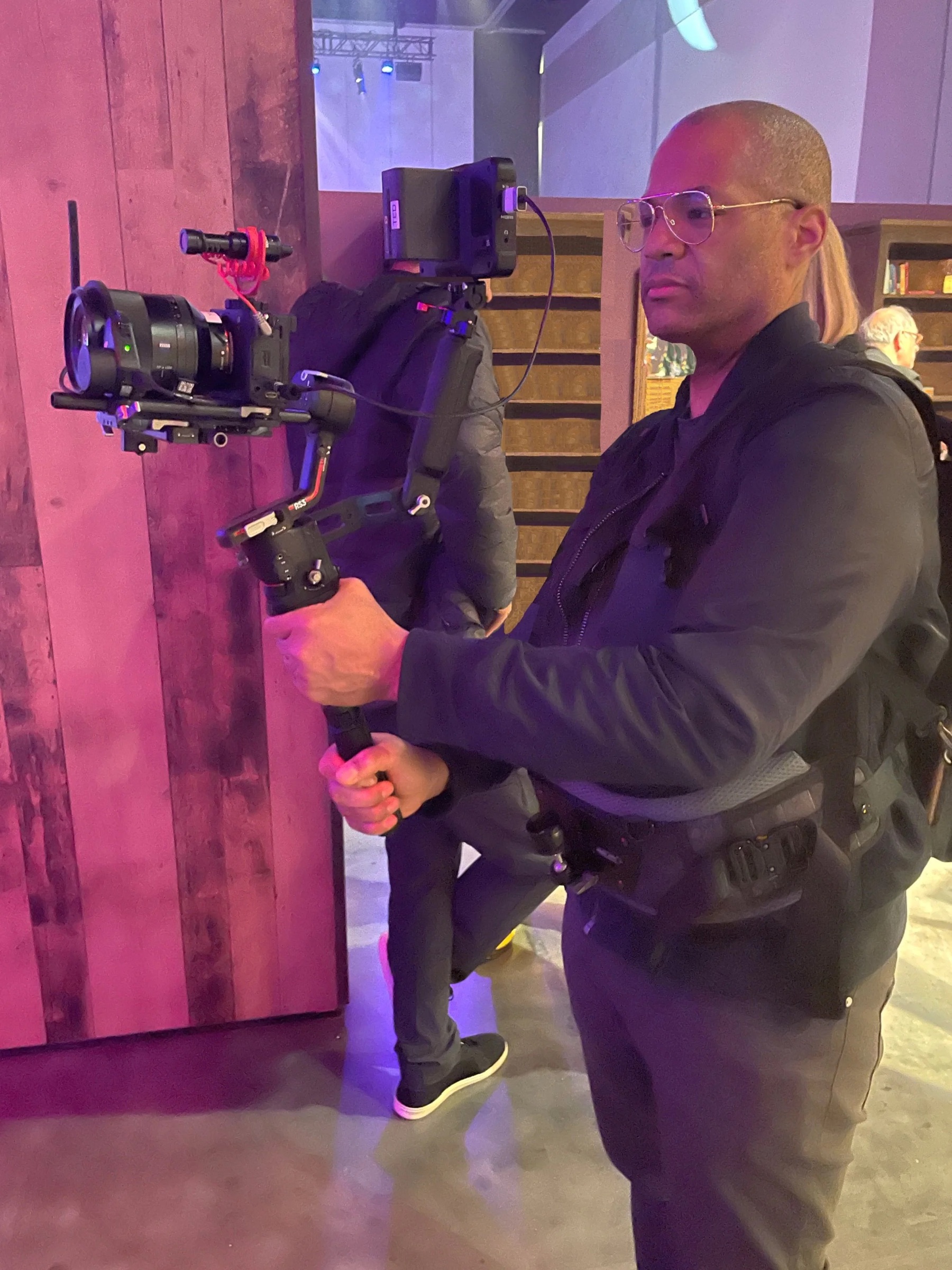 Chris Hardy operating a camera gimbal rig on set